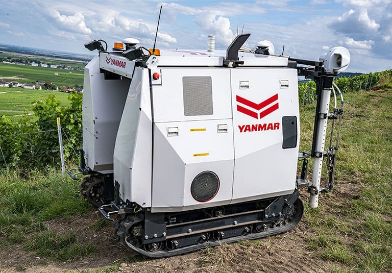 the Yanmar YV01 is an autonomous spraying robot for vineyards