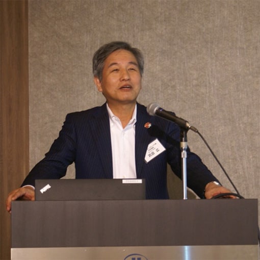 Hiroshi Kanda, Representative Director of Yanmar Holdings Co., Ltd. opening the symposium