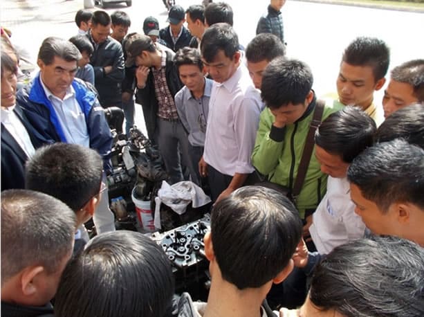 Ha Long Bay trainees gathering around the Yanmar engine